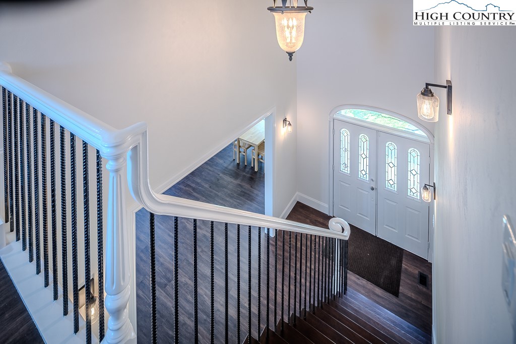 330 North Pinnacle Ridge Road Beech Mountain, NC 28604 - Photo 30 of 38 a view of a hallway with windows and stairs