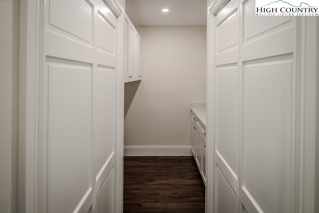 330 North Pinnacle Ridge Road Beech Mountain, NC 28604 - Photo 35 of 38 a view of a hallway with wooden floor and staircase