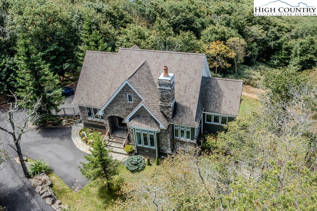 330 North Pinnacle Ridge Road Beech Mountain, NC 28604 - Photo 5 of 38 an aerial view of a house with yard and mountain view in back