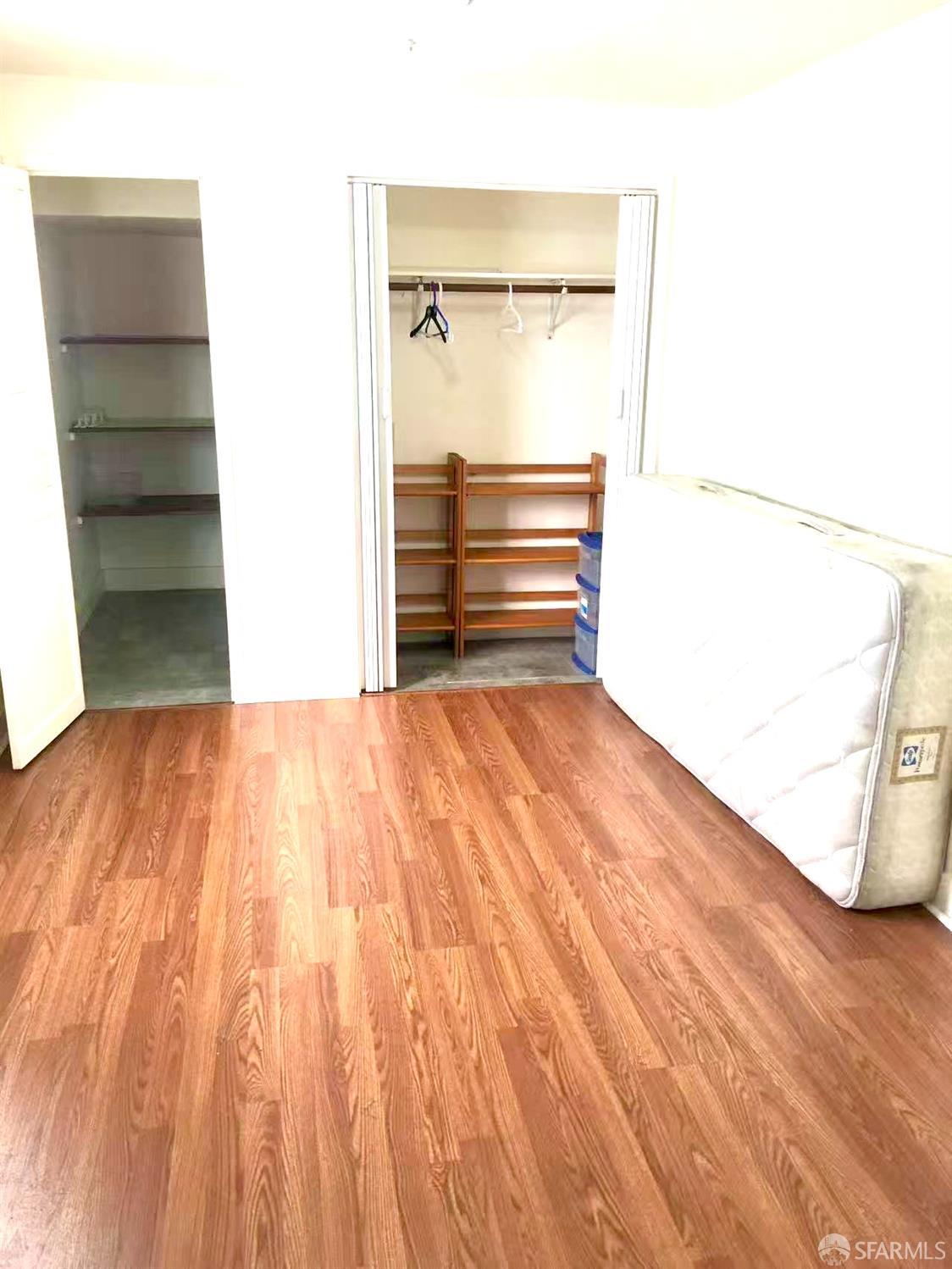 550 A Street Hayward, CA 94541 - Photo 11 of 14 a view of empty room with wooden floor and cabinet