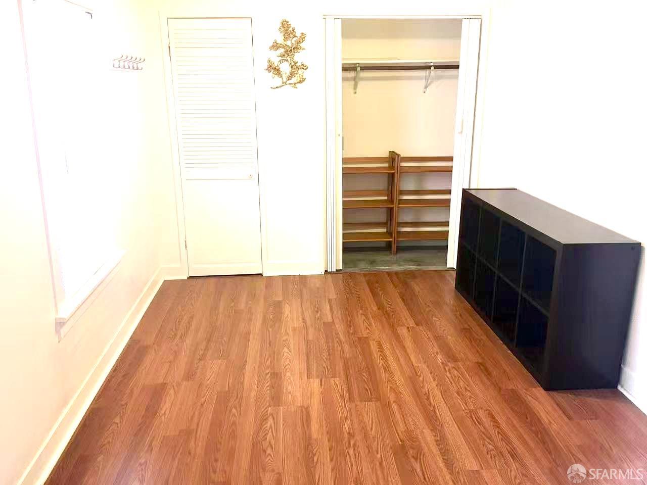 550 A Street Hayward, CA 94541 - Photo 12 of 14 a view of a bedroom with wooden floor and wall