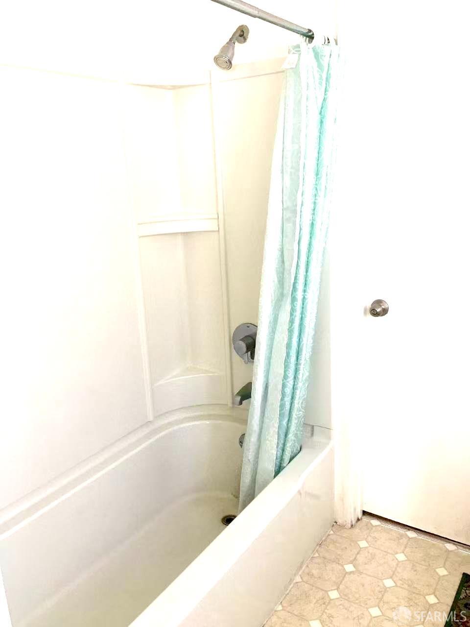 550 A Street Hayward, CA 94541 - Photo 14 of 14 a bathroom with a bathtub and a shower