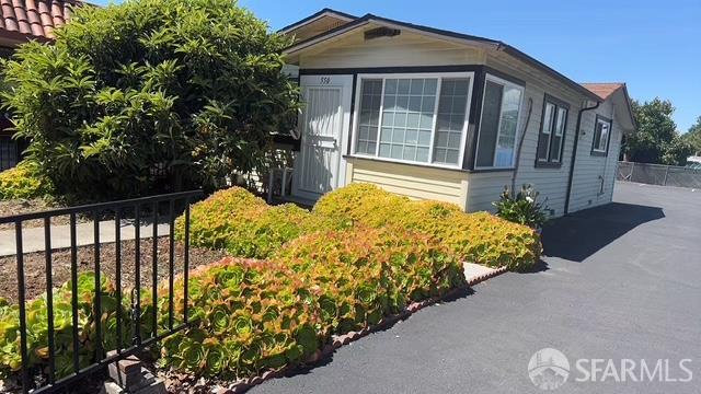 550 A Street Hayward, CA 94541 - Photo 2 of 14 a view of a house with a large window and plants