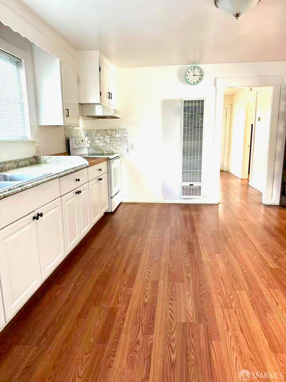 550 A Street Hayward, CA 94541 - Photo 5 of 14 a kitchen with wooden floors and white walls