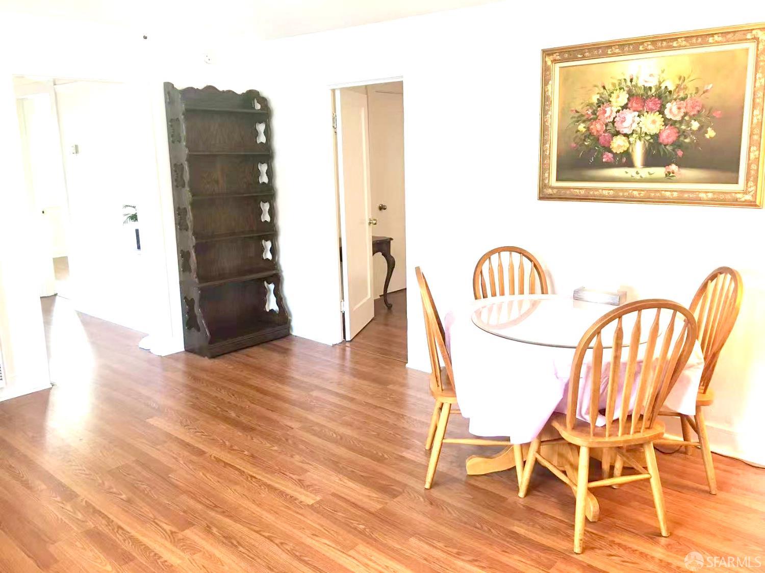 550 A Street Hayward, CA 94541 - Photo 8 of 14 a view of a dining room with furniture and wooden floor