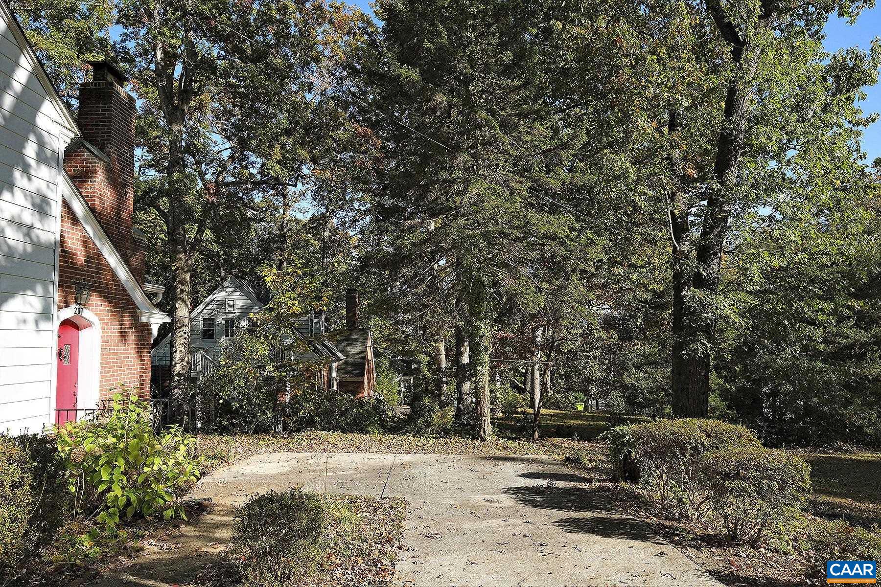 201 Cleveland Avenue Charlottesville, VA 22903 - Photo 11 of 15 a view of a yard with plants and trees