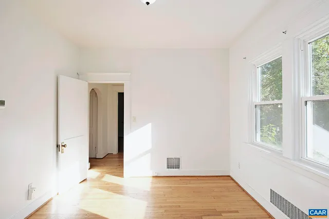 a view of an empty room with a window