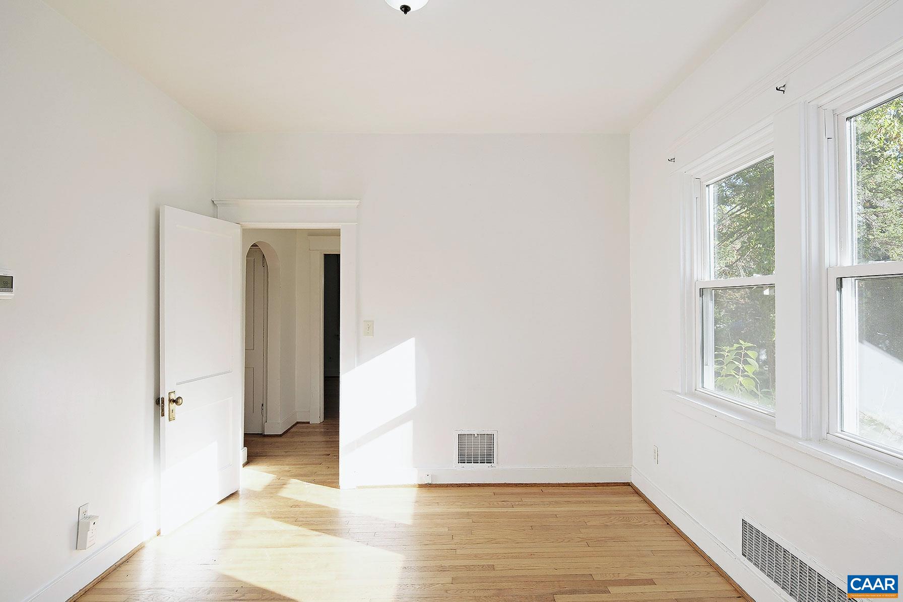 201 Cleveland Avenue Charlottesville, VA 22903 - Photo 3 of 15 a view of an empty room with a window
