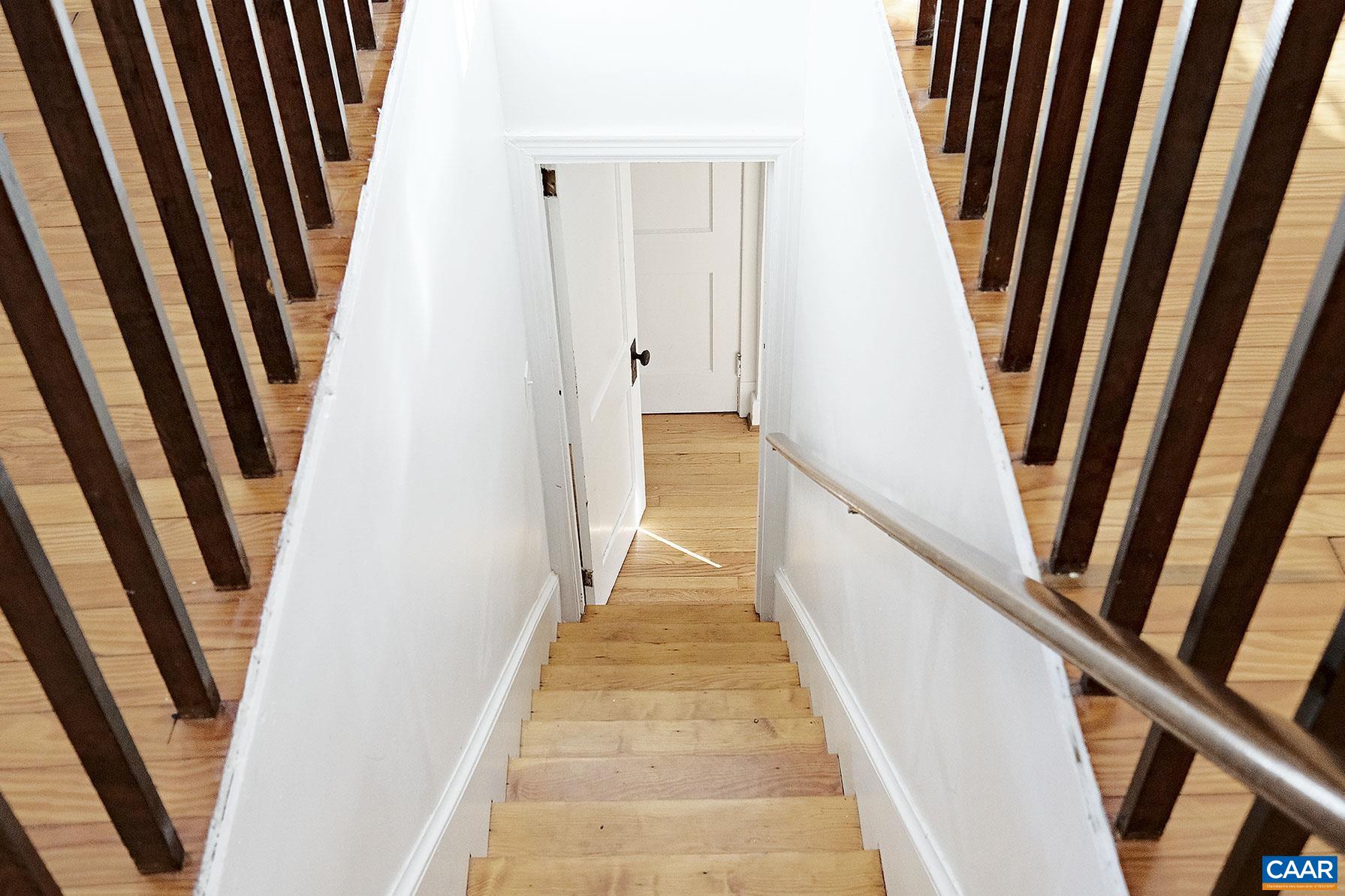 201 Cleveland Avenue Charlottesville, VA 22903 - Photo 5 of 15 a view of a hallway with staircase