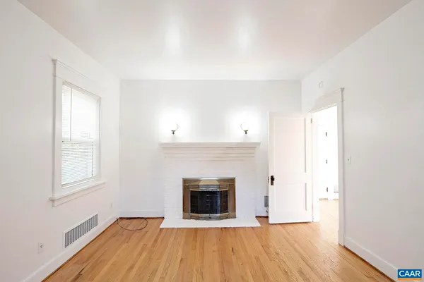 a view of an empty room with a window