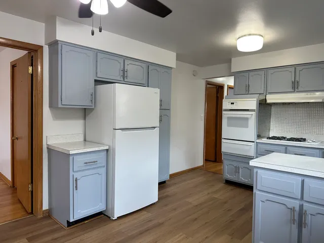 a kitchen with sink cabinets and window