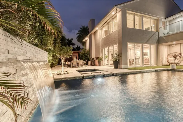 a view of swimming pool with outdoor seating