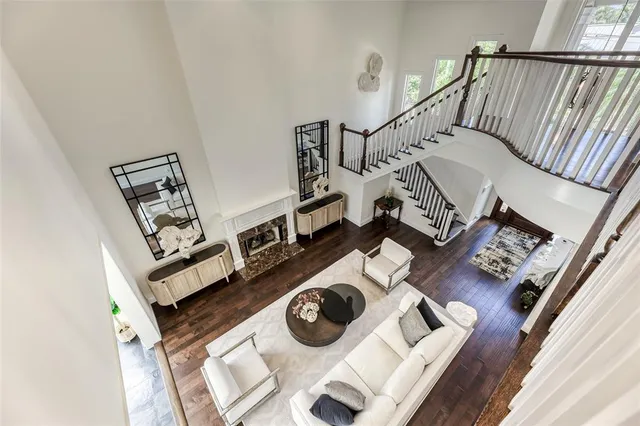 a view of entryway livingroom and hall with wooden floor
