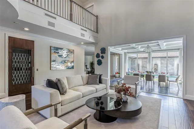 a view of an house with swimming pool and sitting area