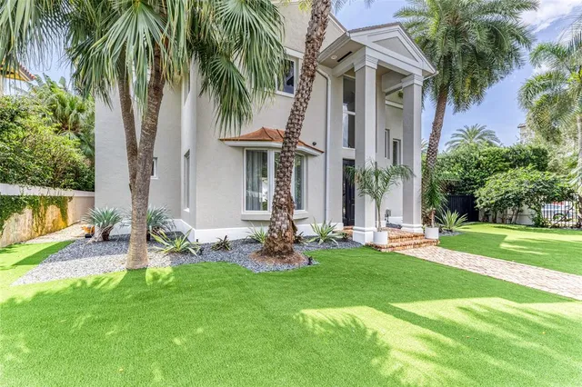 a view of swimming pool with outdoor seating and plants