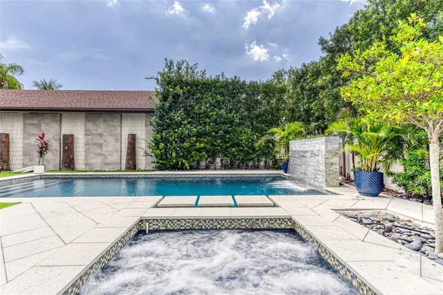 a view of a patio with couches chairs and a potted plant