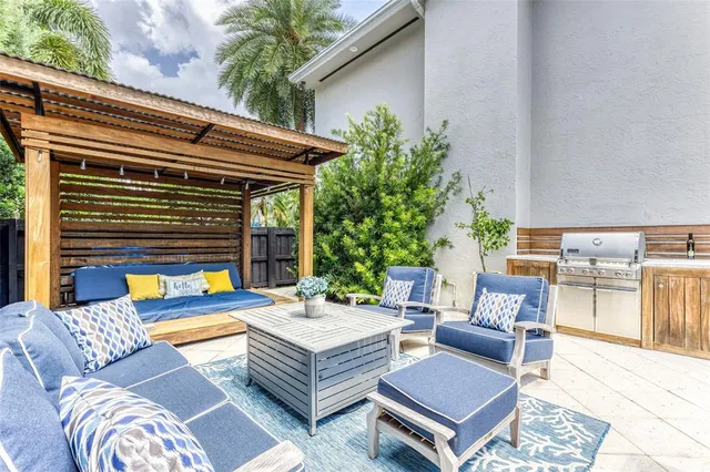 a view of a backyard with potted plants