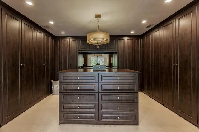 a view of a hallway with chandelier