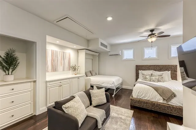 a bedroom with a bed and a couch