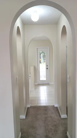 a view of a livingroom with wooden floor and a window
