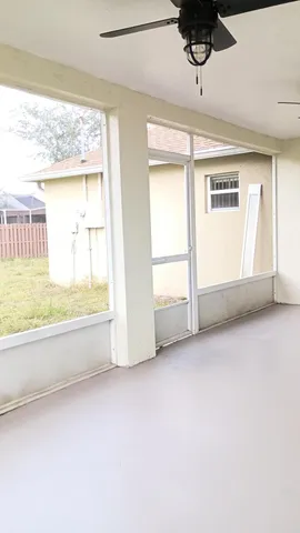 a view of an empty room and window