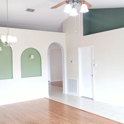 a view of entryway with wooden floor
