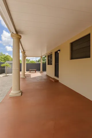 a view of a big room with windows