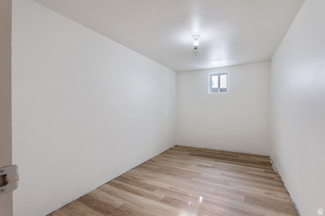 1285 West Maple Street Mapleton, UT 84664 - Photo 22 of 35 Room with light wood-finish flooring, white walls, and a single window