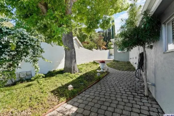 a view of a house with a yard and garage