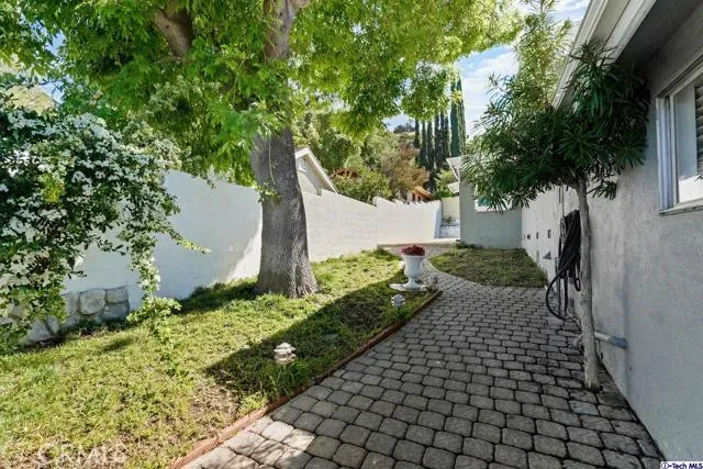 a view of a house with a yard and garage