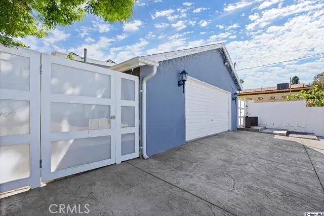 a view of a house with a yard and plant