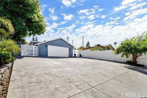 an aerial view of a house with outdoor space