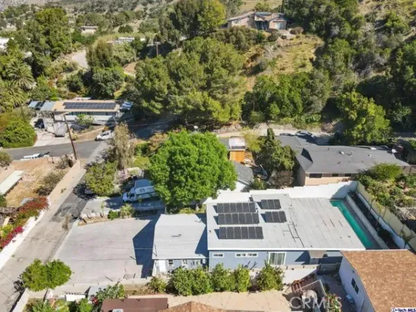 an aerial view of residential houses with outdoor space