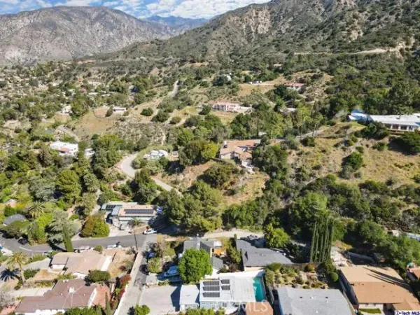 an aerial view of houses with outdoor space