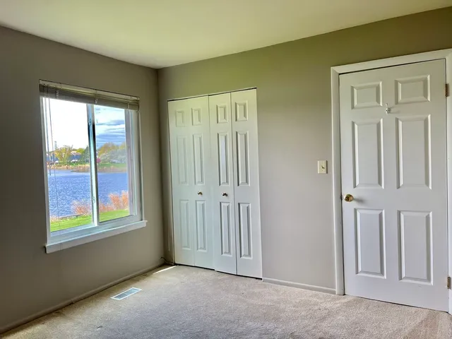 an empty room that has a window