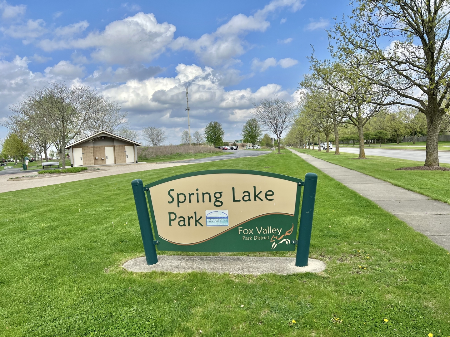 370 Springlake Lane, Unit B Aurora, IL 60504 - Photo 26 of 26 a sign that is sitting on the grass of the house