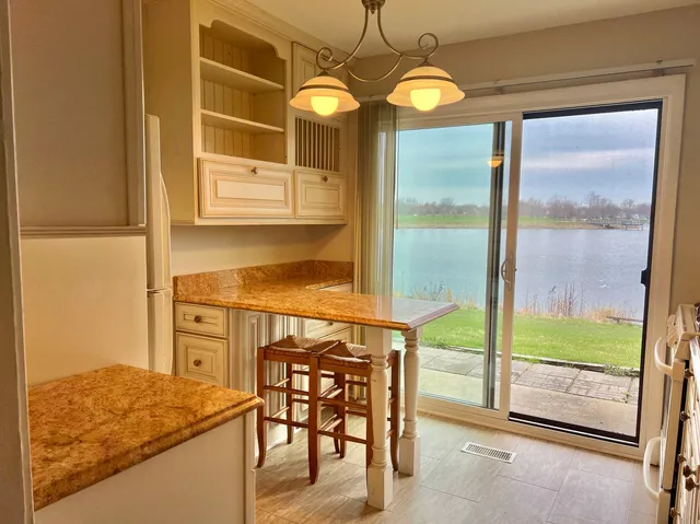 a dining room with furniture window and outside view