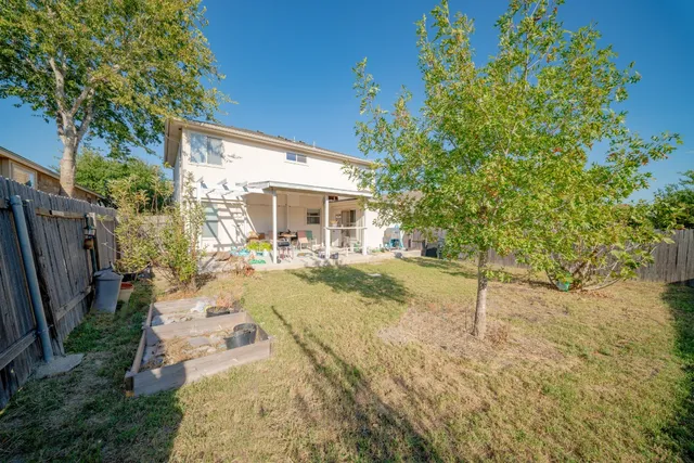 a view of house with yard