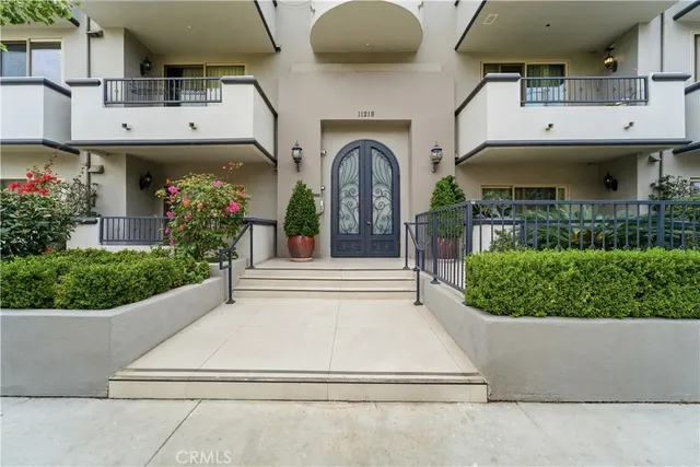 an aerial view of residential houses with city view