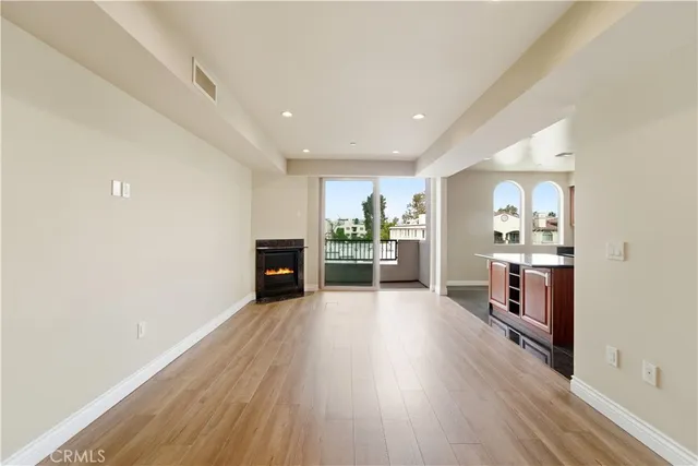 a view of a kitchen with wooden floor