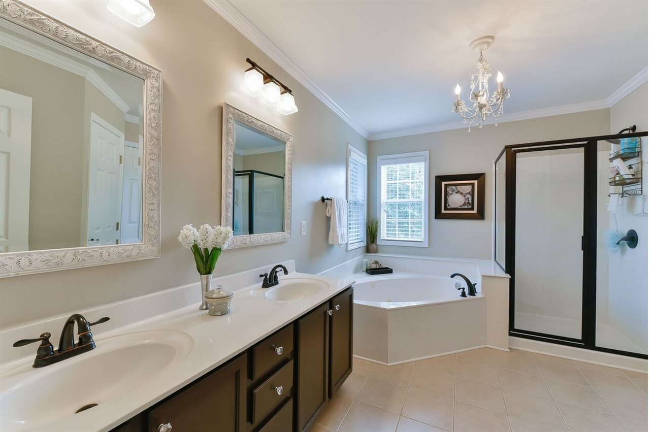5529 Rush Springs Court Raleigh, NC 27617 - Photo 12 of 14 Topped with a cherry...I mean a pretty chandelier. Master Bath/Spa