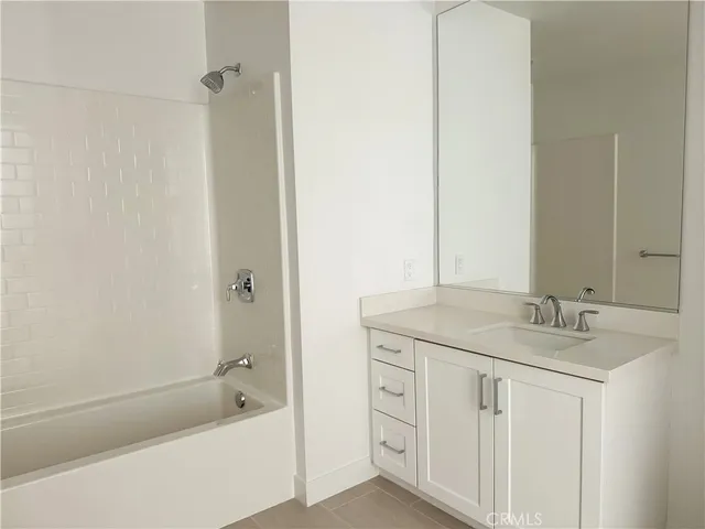 a lobby with furniture and a potted plant