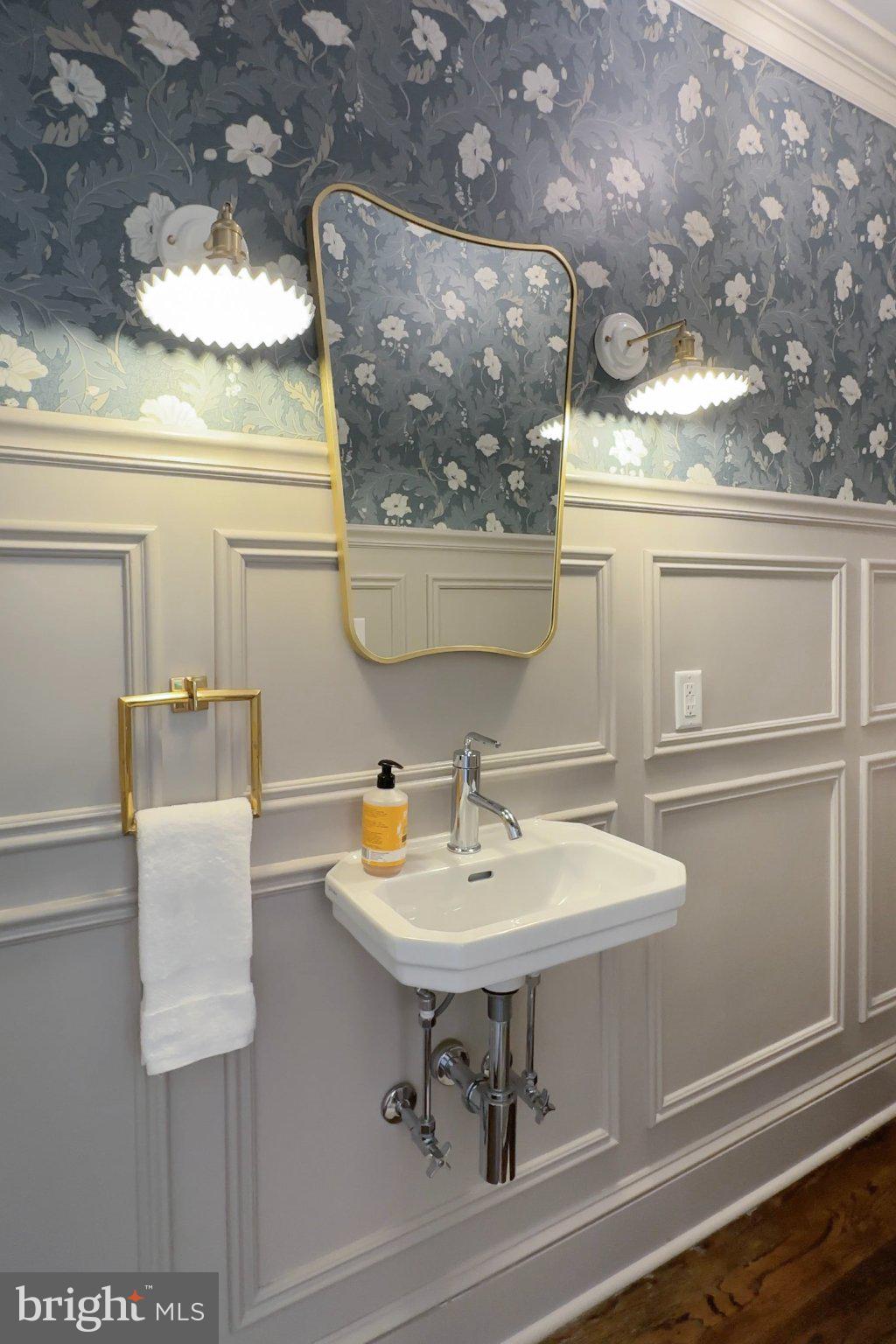 7005 Copeleigh Road Baltimore, MD 21212 - Photo 17 of 51 a bathroom with a sink and a mirror