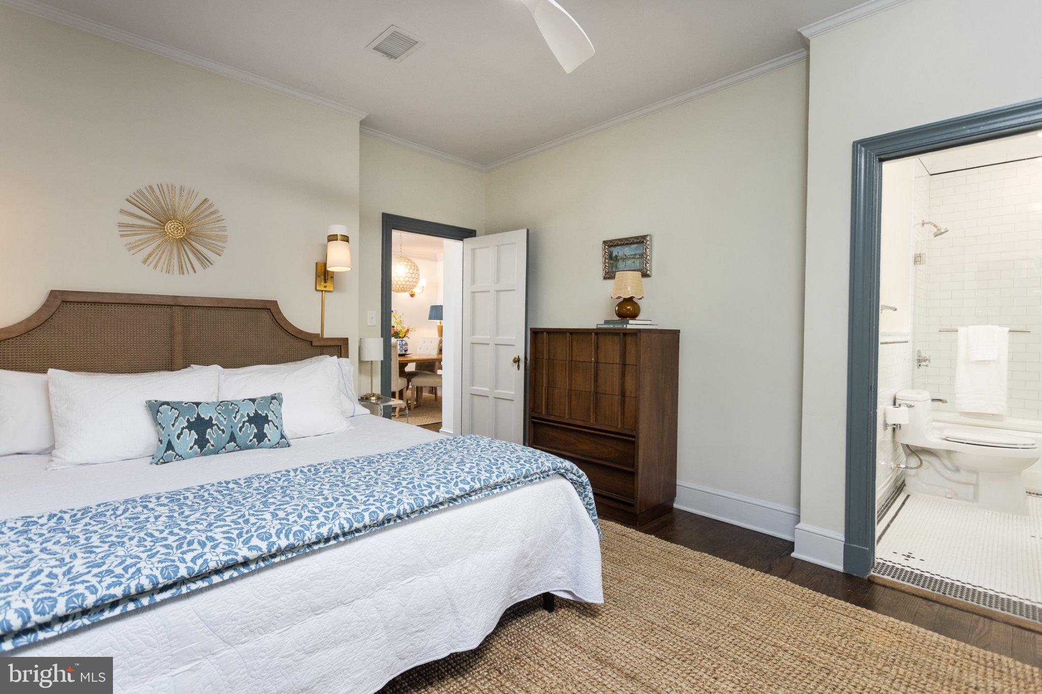7005 Copeleigh Road Baltimore, MD 21212 - Photo 26 of 51 a bedroom with a large bed and a chandelier