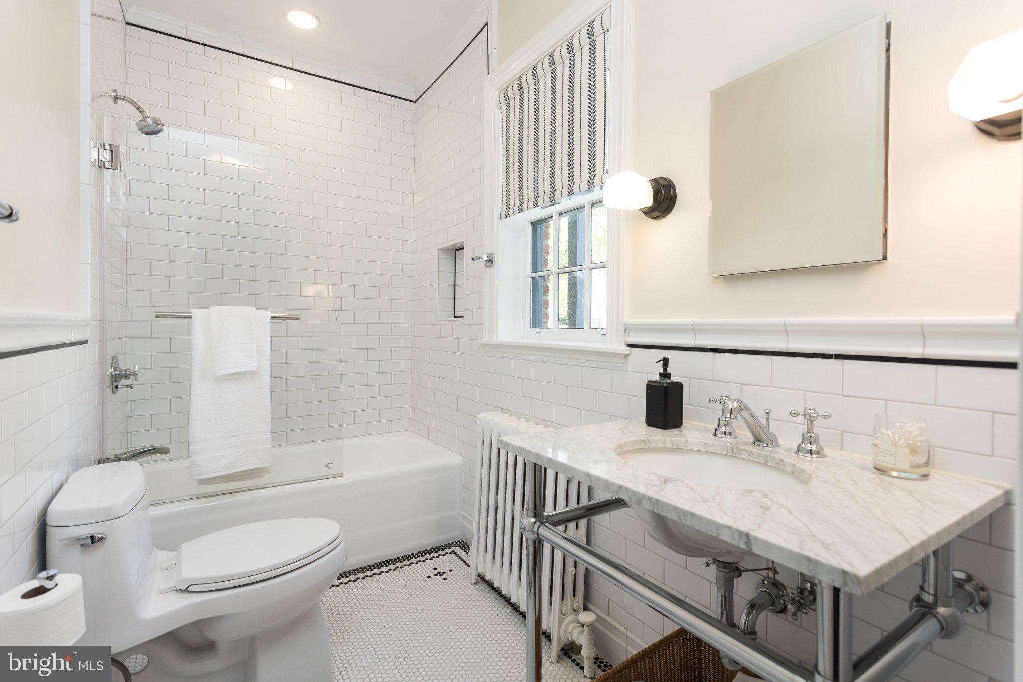 7005 Copeleigh Road Baltimore, MD 21212 - Photo 27 of 51 a bathroom with a sink toilet and shower