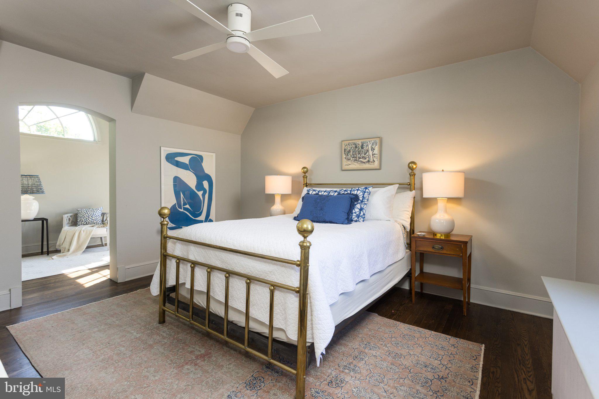 7005 Copeleigh Road Baltimore, MD 21212 - Photo 29 of 51 a bedroom with a bed and a lamp