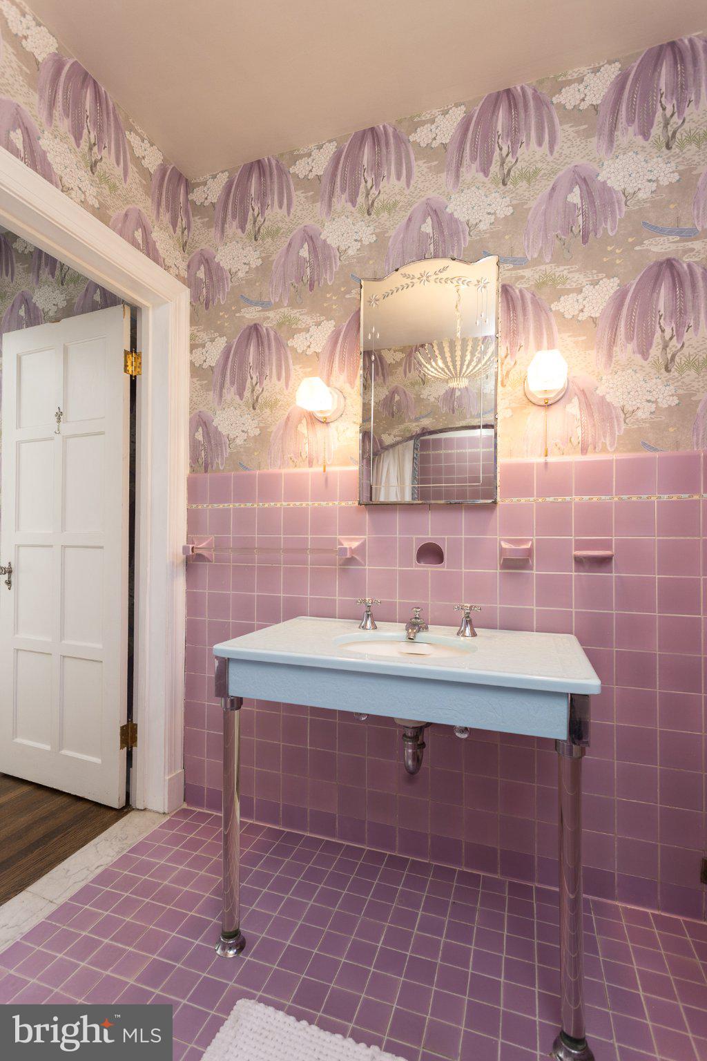 7005 Copeleigh Road Baltimore, MD 21212 - Photo 34 of 51 a bathroom with a sink mirror and a shower