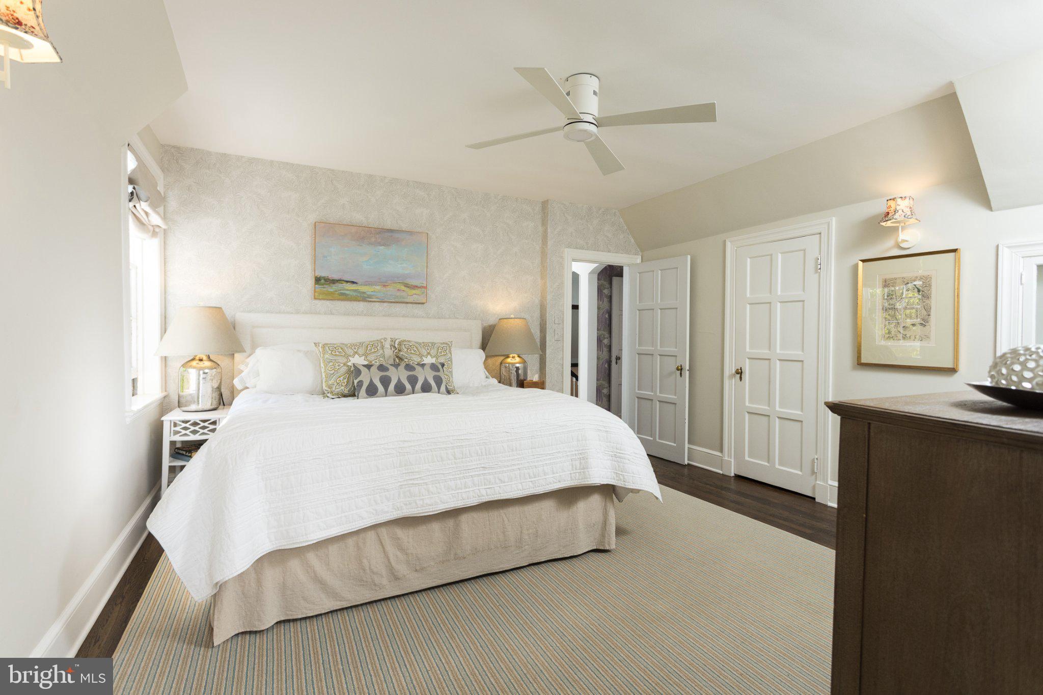 7005 Copeleigh Road Baltimore, MD 21212 - Photo 36 of 51 a spacious bedroom with a bed and a chandelier