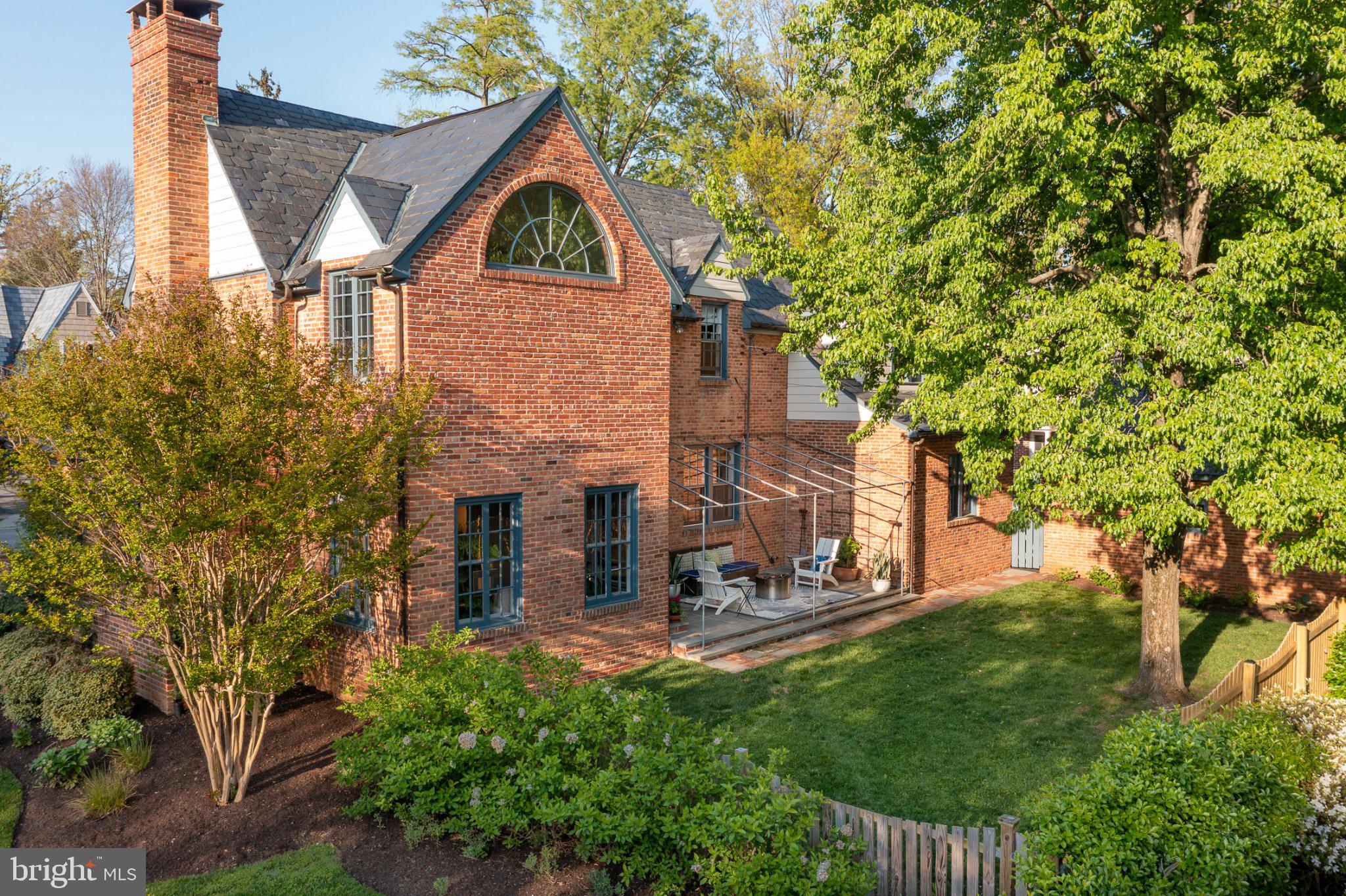7005 Copeleigh Road Baltimore, MD 21212 - Photo 4 of 51 a view of a house with brick walls and a tree