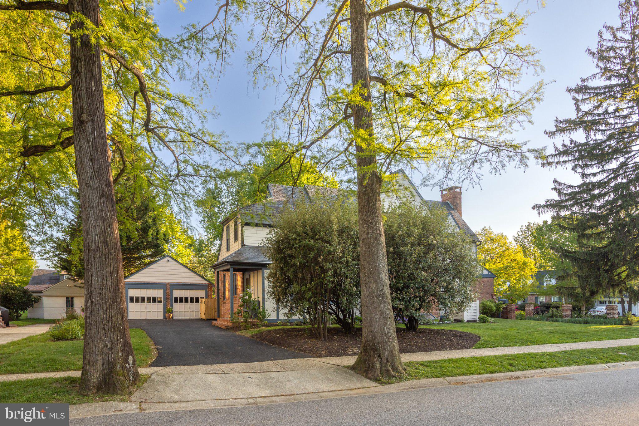 7005 Copeleigh Road Baltimore, MD 21212 - Photo 5 of 51 a front view of a house with a yard and large trees